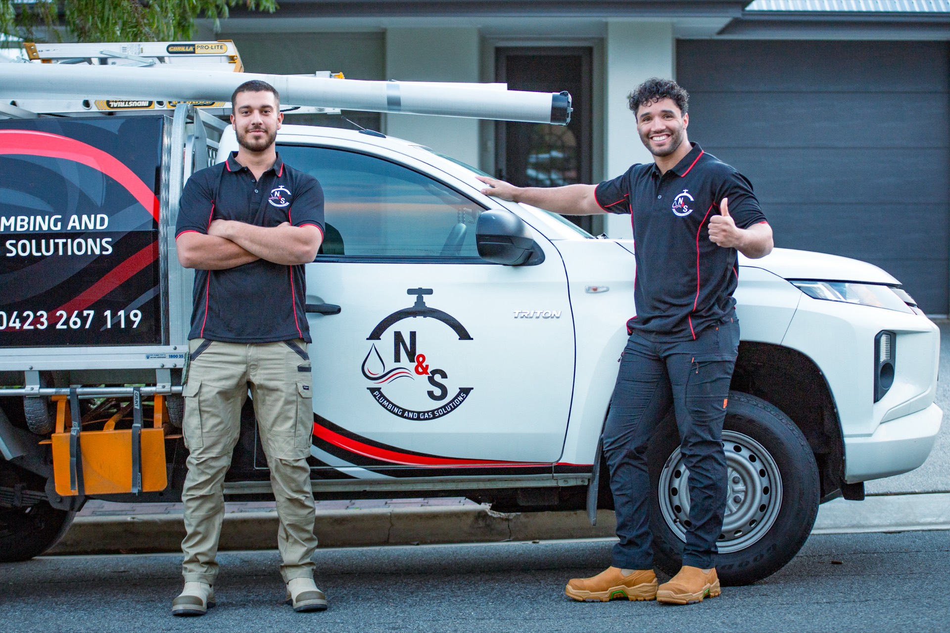 N&S Plumbing team with service vehicle