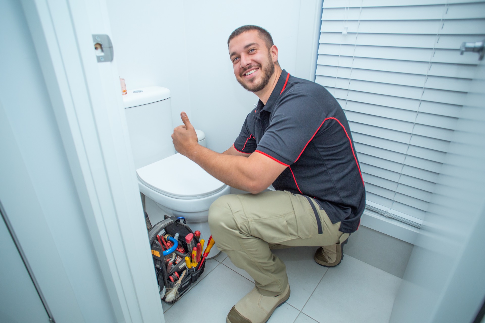 Plumber completing a bathroom job
